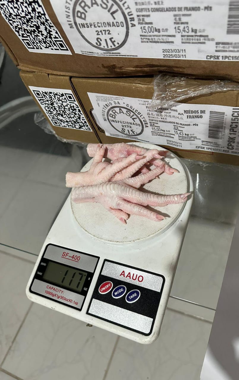 Close-up of Grade A premium frozen chicken paws